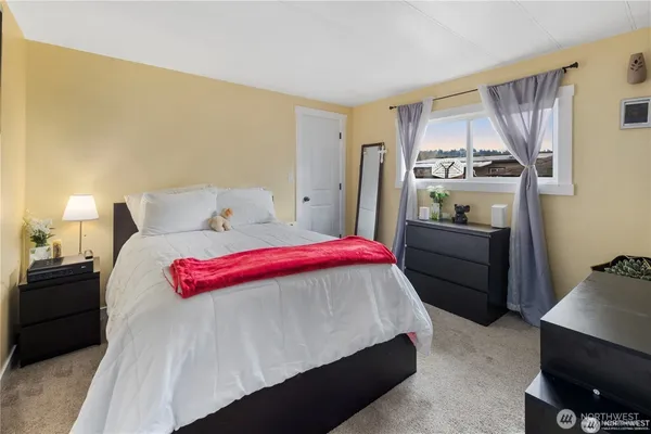 a bedroom with a bed and a table in it