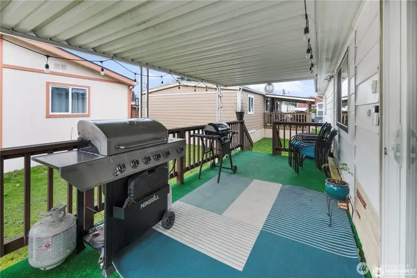 a view of a porch with furniture and garden