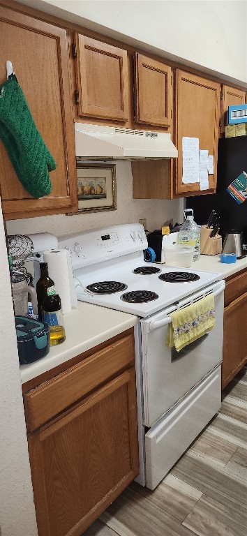 4001 Tanglewilde Street, Unit 1204 Houston, TX 77063 - Photo 3 of 11 a kitchen with stainless steel appliances granite countertop a sink and a stove