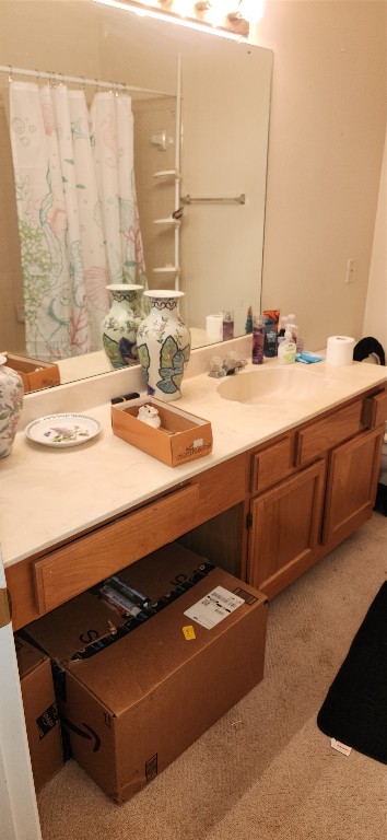4001 Tanglewilde Street, Unit 1204 Houston, TX 77063 - Photo 6 of 11 a bathroom with a sink and a mirror
