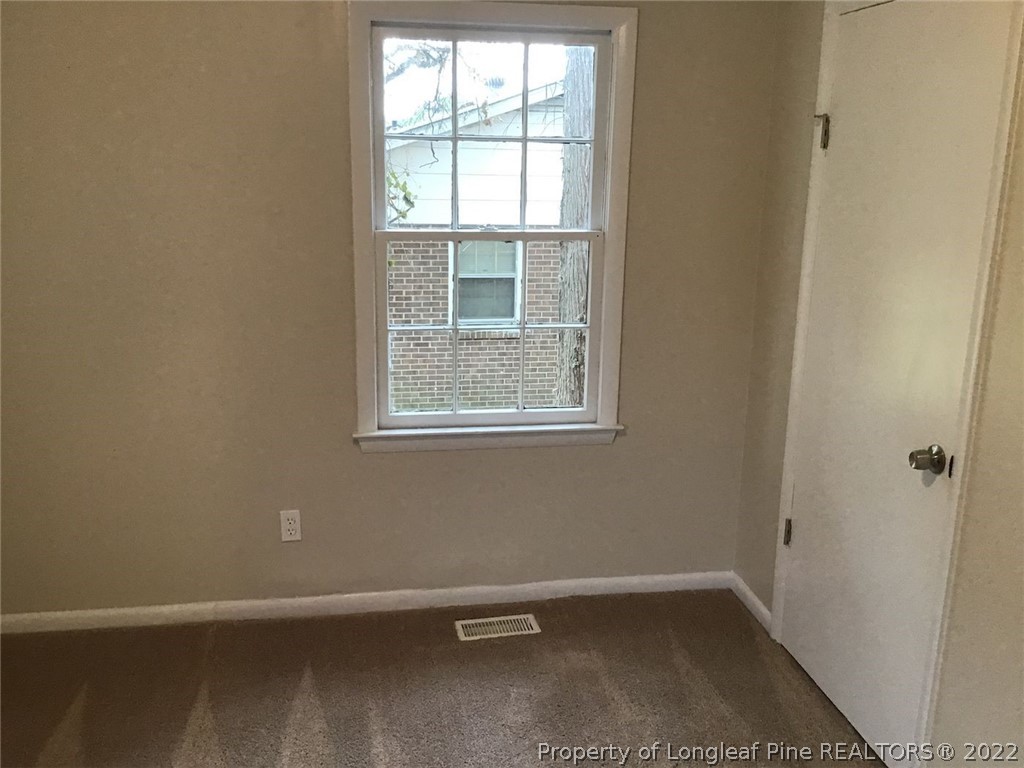 5035 Steed Road Fayetteville, NC 28306 - Photo 6 of 8 an empty room with a window