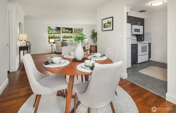 a view of a dining room with furniture window and wooden floor