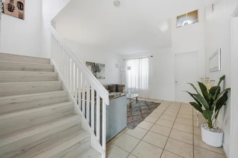 a view of entryway with wooden floor