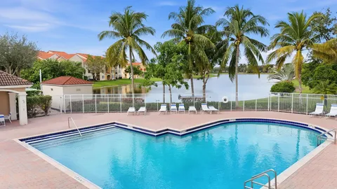 an aerial view of house with swimming pool and outdoor space