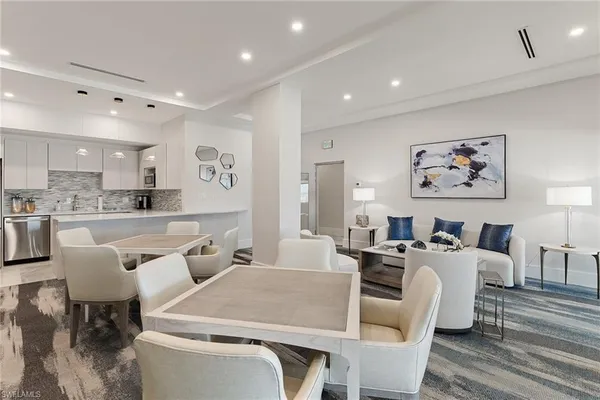 a large living room with stainless steel appliances kitchen island granite countertop furniture and a view of kitchen