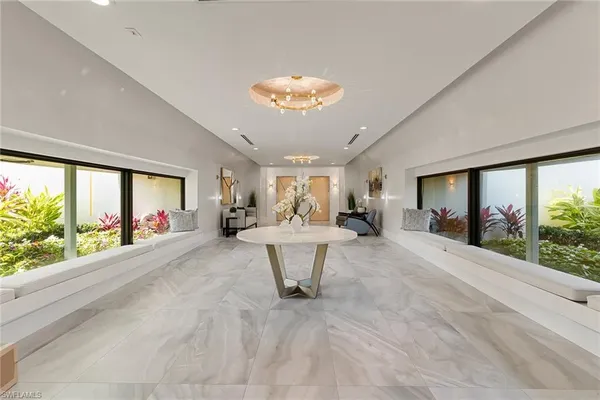 a view of a dining room with furniture window and outside view