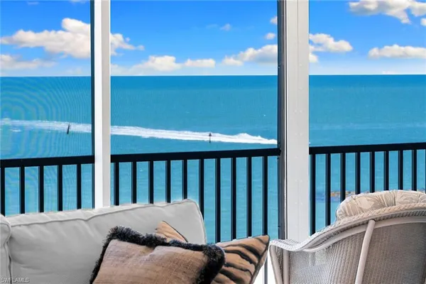 a balcony view with a backyard space