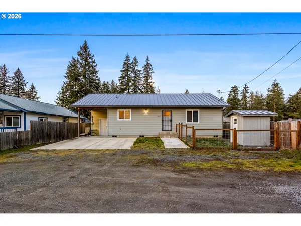 a view of a yard and front view of a house