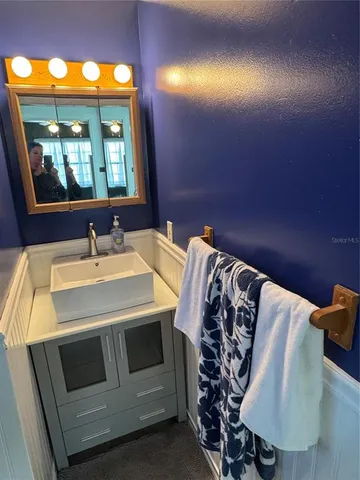 a bathroom with a sink and a mirror