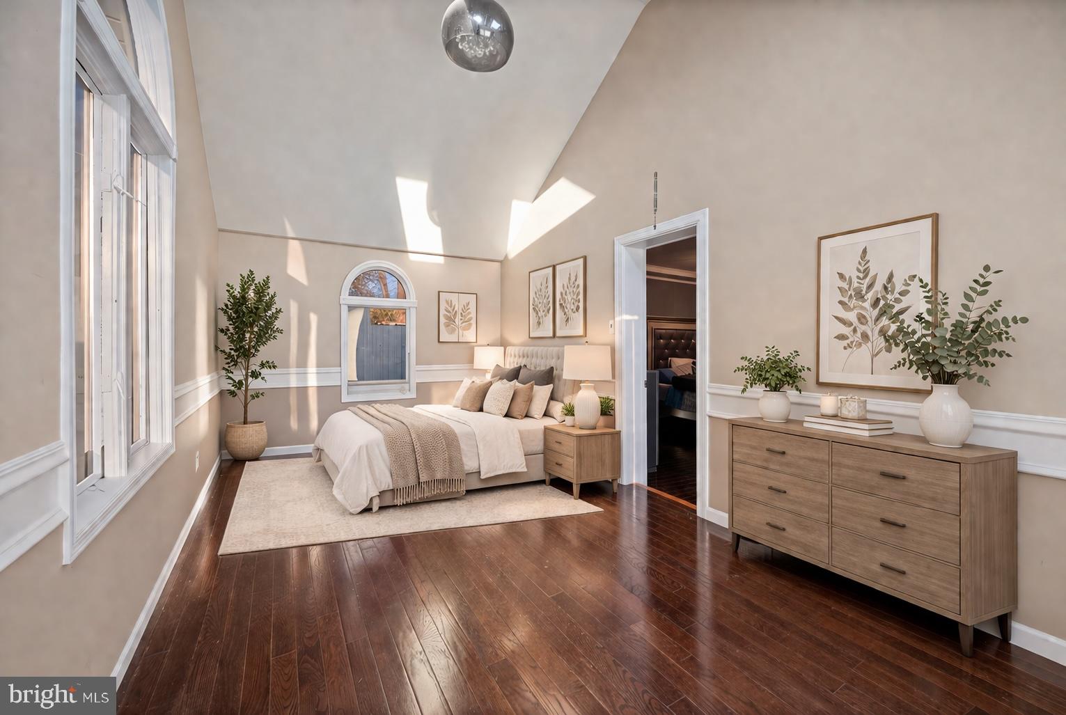 7902 Bridge Avenue Baltimore, MD 21237 - Photo 16 of 28 a spacious bedroom with a large bed and a dresser