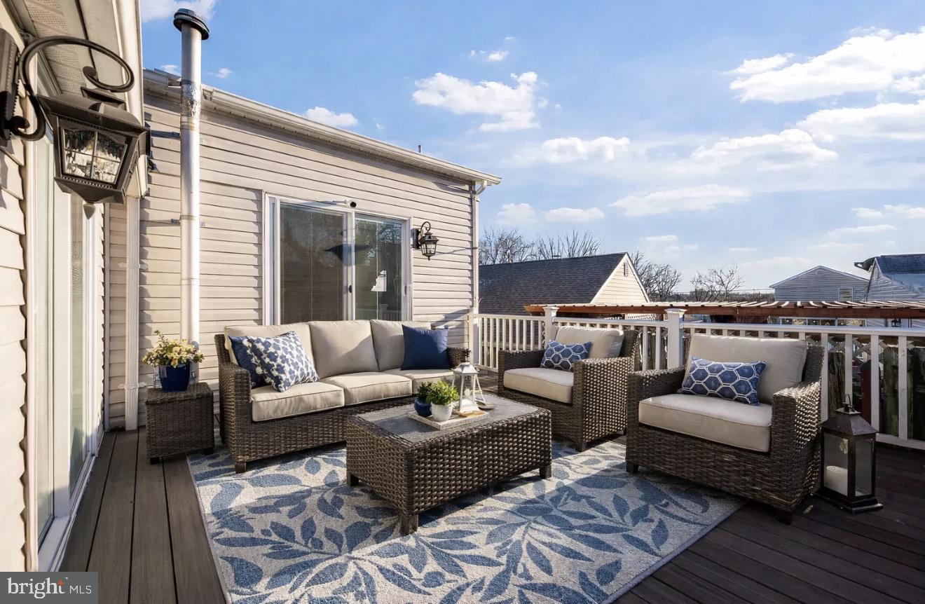 7902 Bridge Avenue Baltimore, MD 21237 - Photo 18 of 28 a outdoor living room with furniture