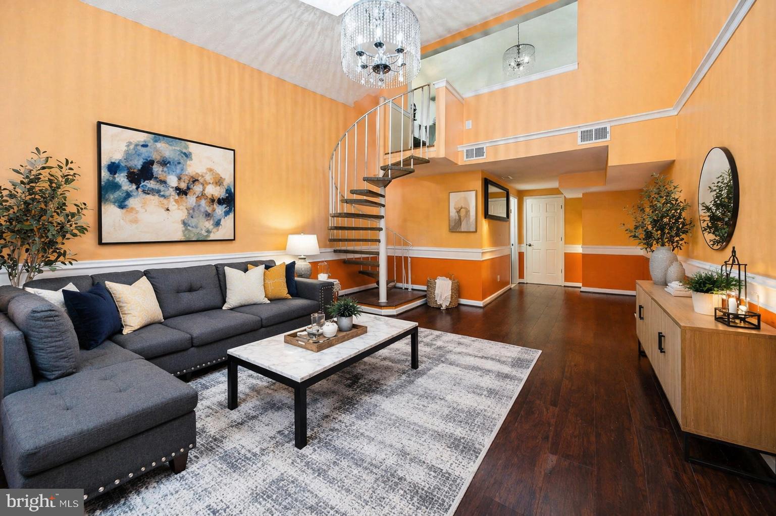 7902 Bridge Avenue Baltimore, MD 21237 - Photo 2 of 28 a living room with furniture and a chandelier