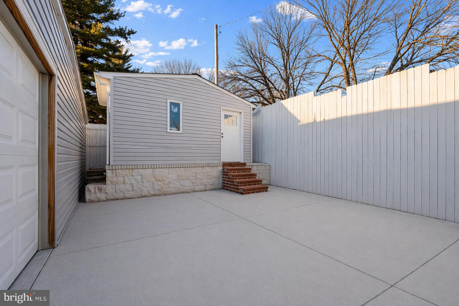 7902 Bridge Avenue Baltimore, MD 21237 - Photo 22 of 28 a view of a house with a back yard