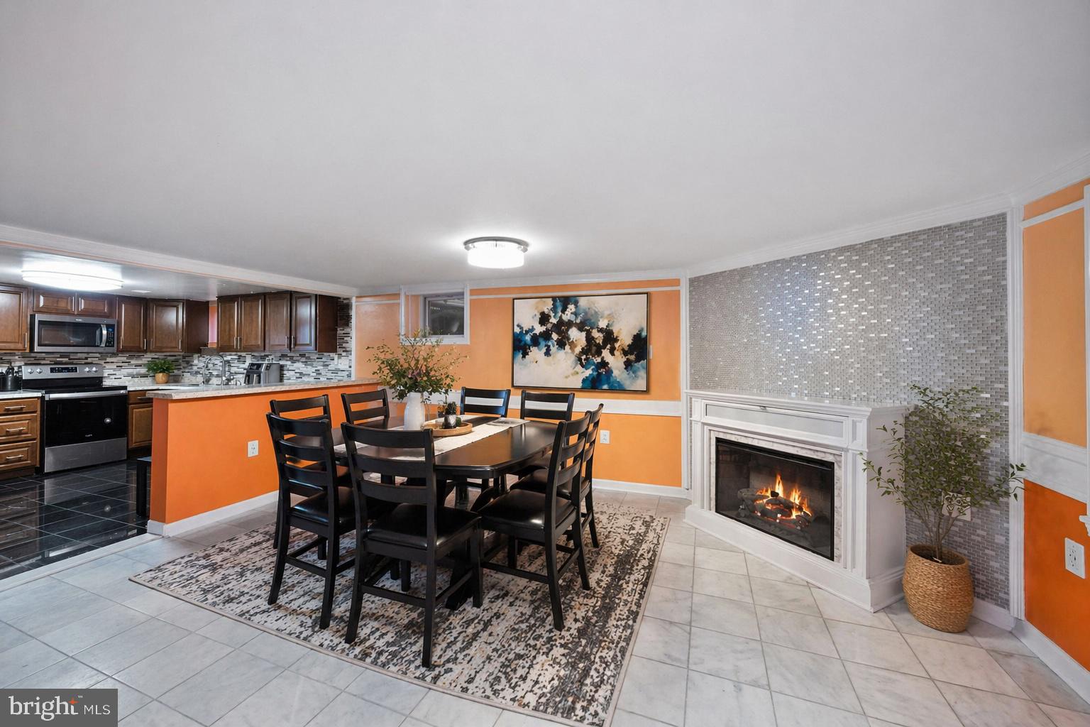7902 Bridge Avenue Baltimore, MD 21237 - Photo 6 of 28 a view of a dining room with furniture and chandelier