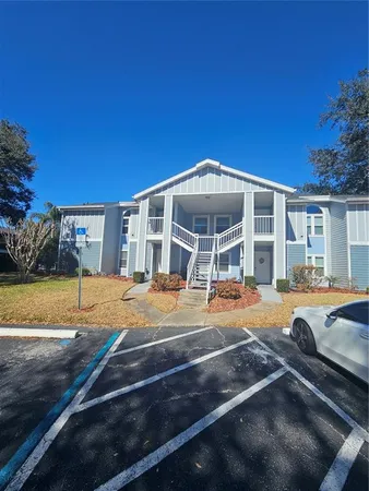 a view of a house with swimming pool and porch