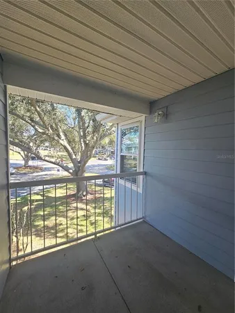 a view of empty room with ceiling fan