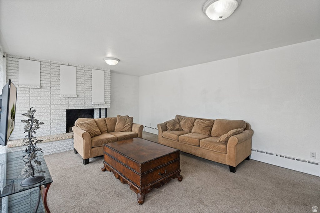 149 West 1600th Street South Mapleton, UT 84664 - Photo 7 of 44 Carpeted living area featuring baseboard heating and a fireplace