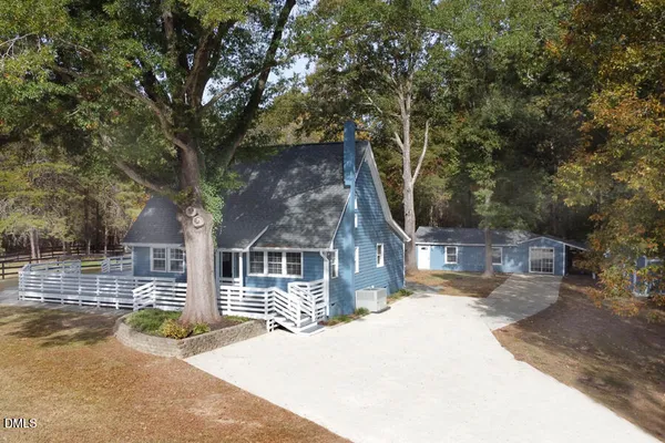 a house with trees in front of it