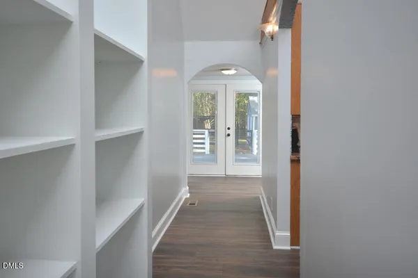 a kitchen with stainless steel appliances granite countertop a refrigerator a stove and a wooden cabinets