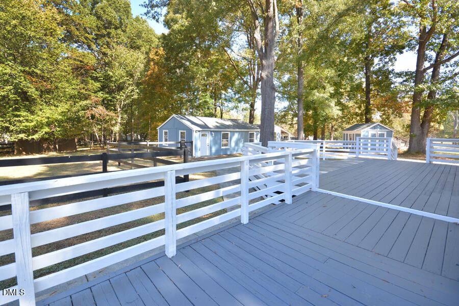 220 Bill Poole Road Rougemont, NC 27572 - Photo 49 of 63 a view of a roof deck with wooden floor and fence