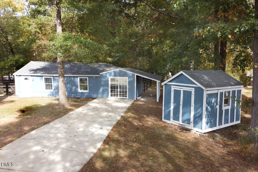220 Bill Poole Road Rougemont, NC 27572 - Photo 56 of 63 a view of a house with a yard