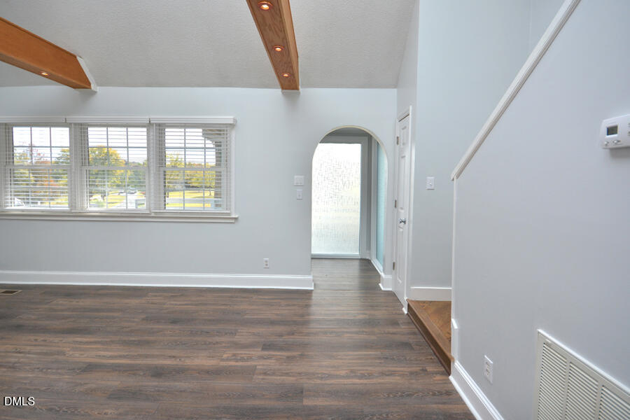 220 Bill Poole Road Rougemont, NC 27572 - Photo 6 of 63 a view of an empty room with wooden floor and a window