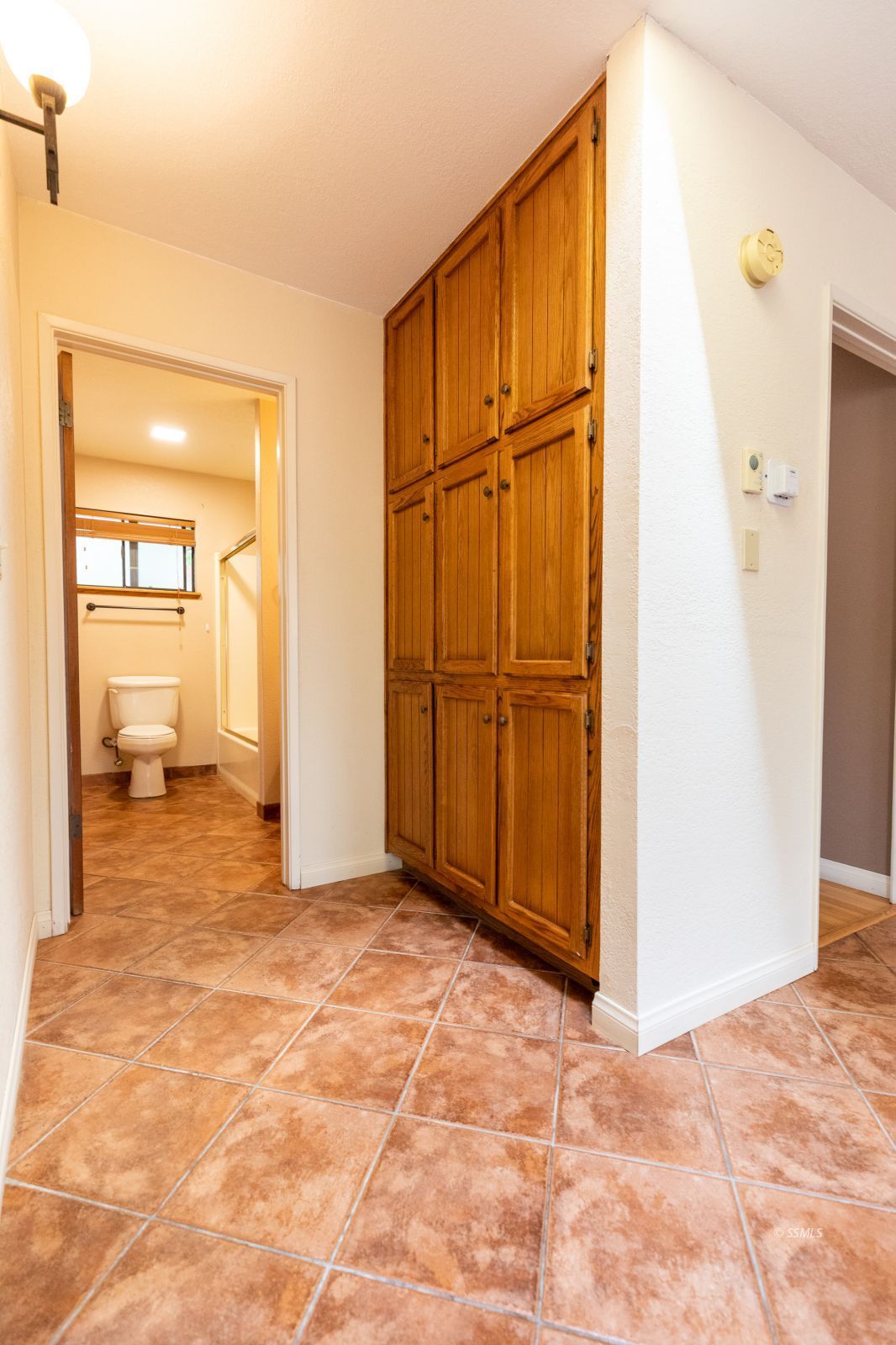 813 West Perdew Avenue Ridgecrest, CA 93555 - Photo 17 of 28 a view of a livingroom with wooden floor and a bathroom