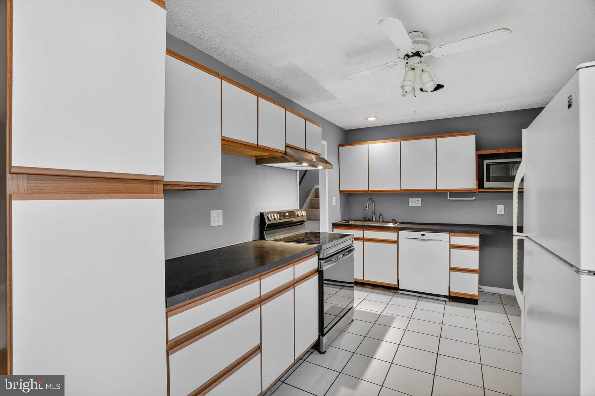 704 Ferguson Road Joppa, MD 21085 - Photo 17 of 30 a kitchen with a sink appliances and cabinets