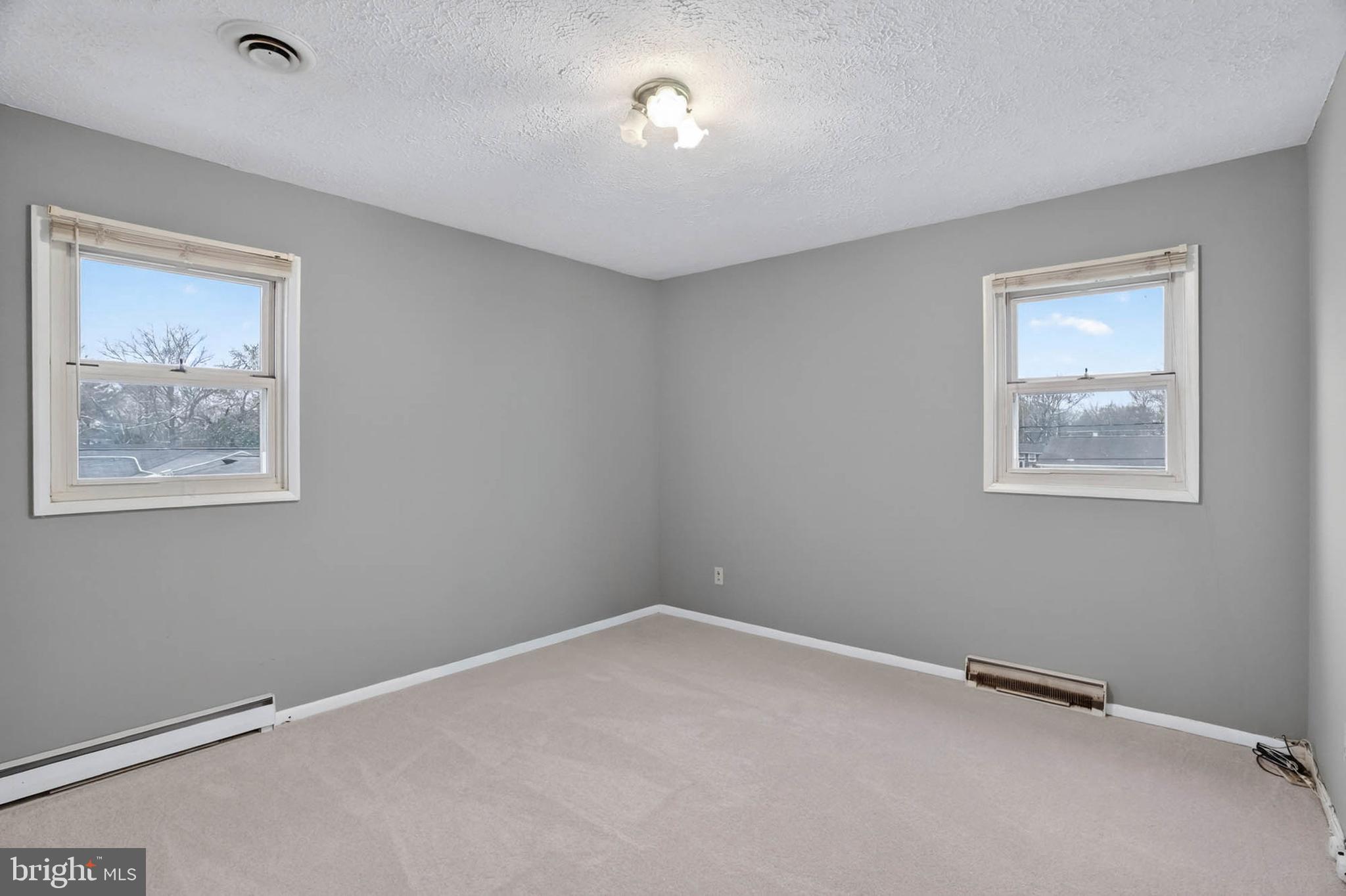704 Ferguson Road Joppa, MD 21085 - Photo 20 of 30 a view of room with window and ceiling fan