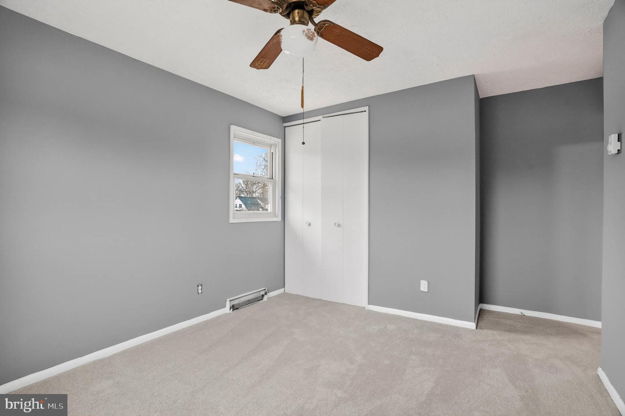 704 Ferguson Road Joppa, MD 21085 - Photo 24 of 30 a view of a room with a ceiling fan and a fan