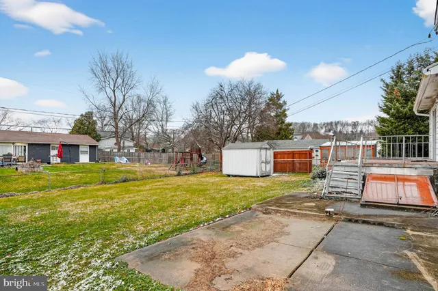 a view of a house with pool and yard
