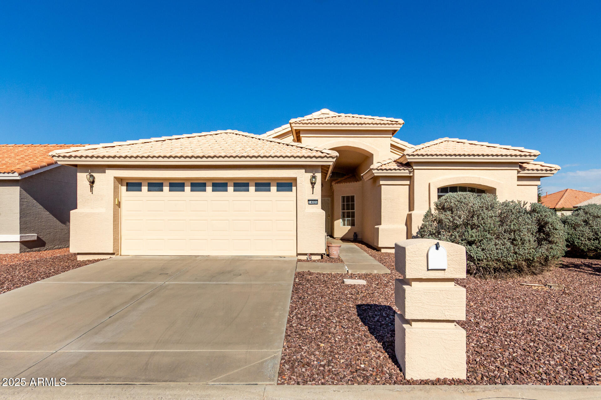 14806 West Verde Lane Goodyear, AZ 85395 - Photo 2 of 30 a front view of a house with a garage