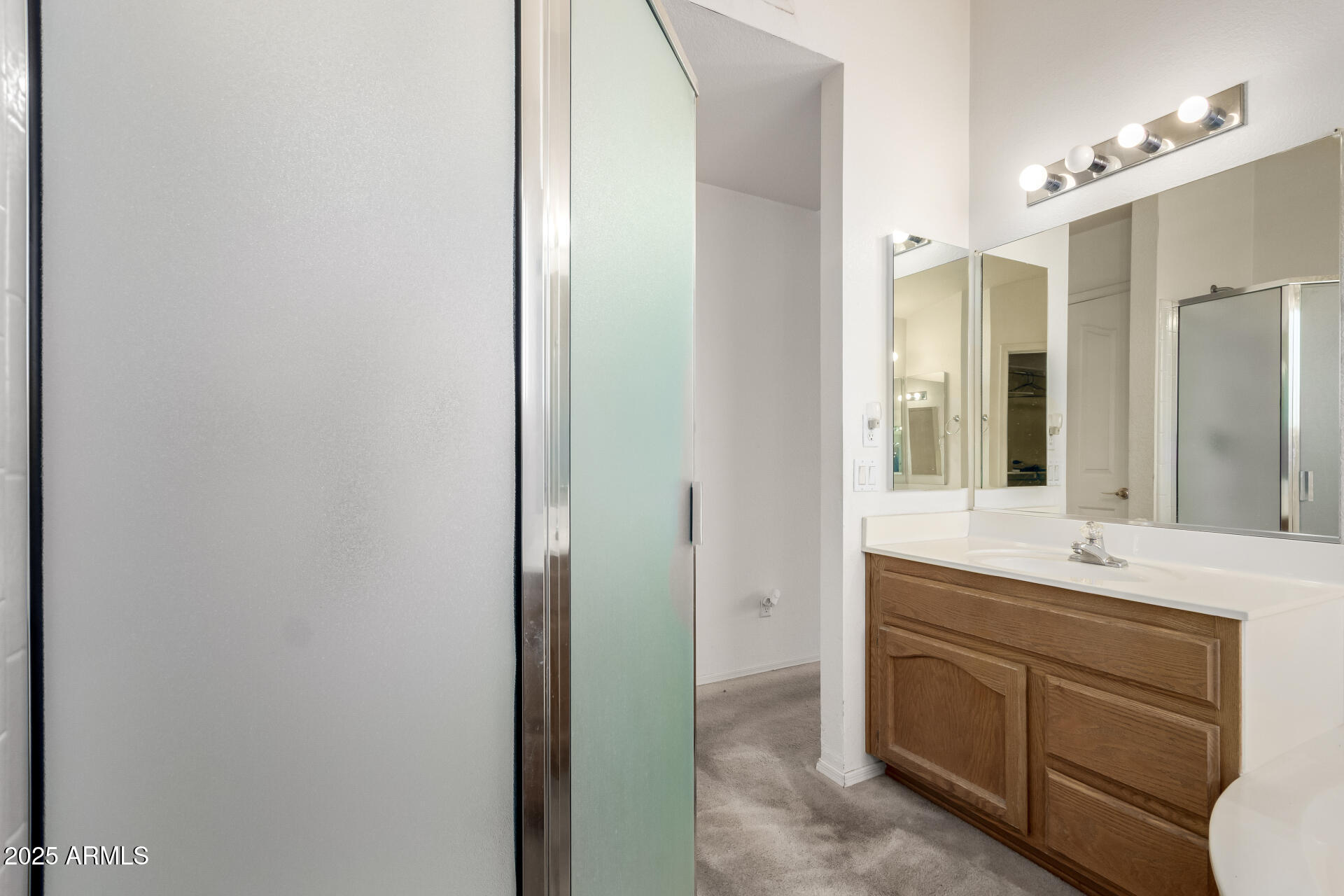 14806 West Verde Lane Goodyear, AZ 85395 - Photo 26 of 30 a bathroom with a sink and a mirror