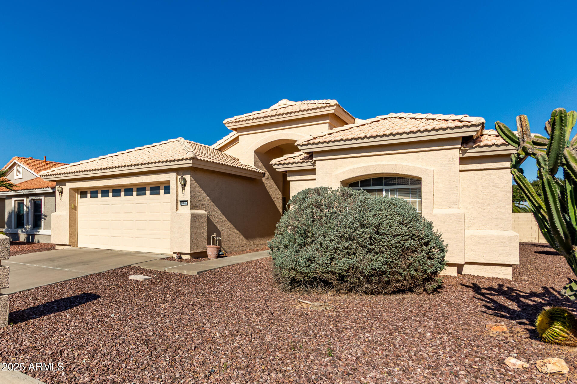 14806 West Verde Lane Goodyear, AZ 85395 - Photo 4 of 30 a view of a house with a small yard and potted plants