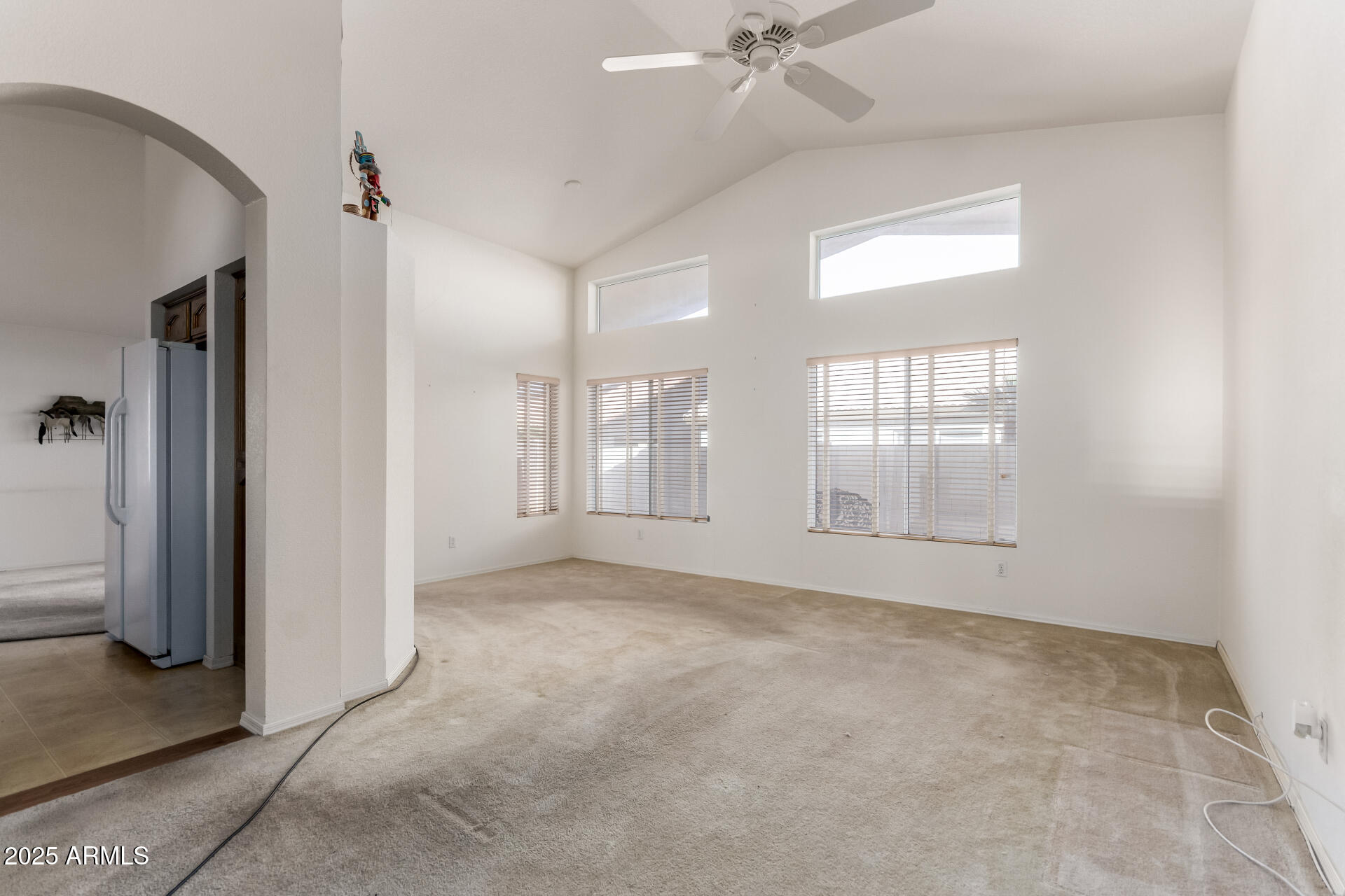 14806 West Verde Lane Goodyear, AZ 85395 - Photo 8 of 30 an empty room with windows