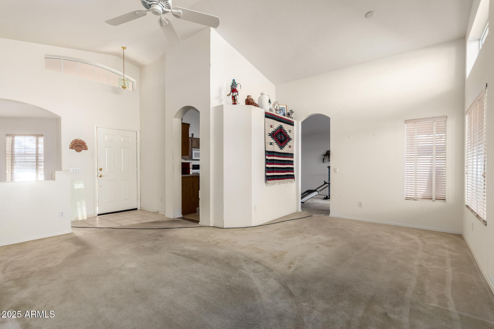 14806 West Verde Lane Goodyear, AZ 85395 - Photo 9 of 30 a view of a livingroom with a staircase