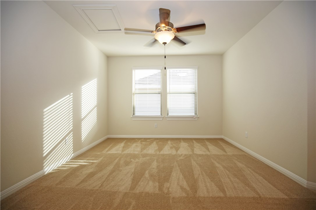 15912 Cessida Street Austin, TX 78728 - Photo 17 of 23 a view of an empty room with a window