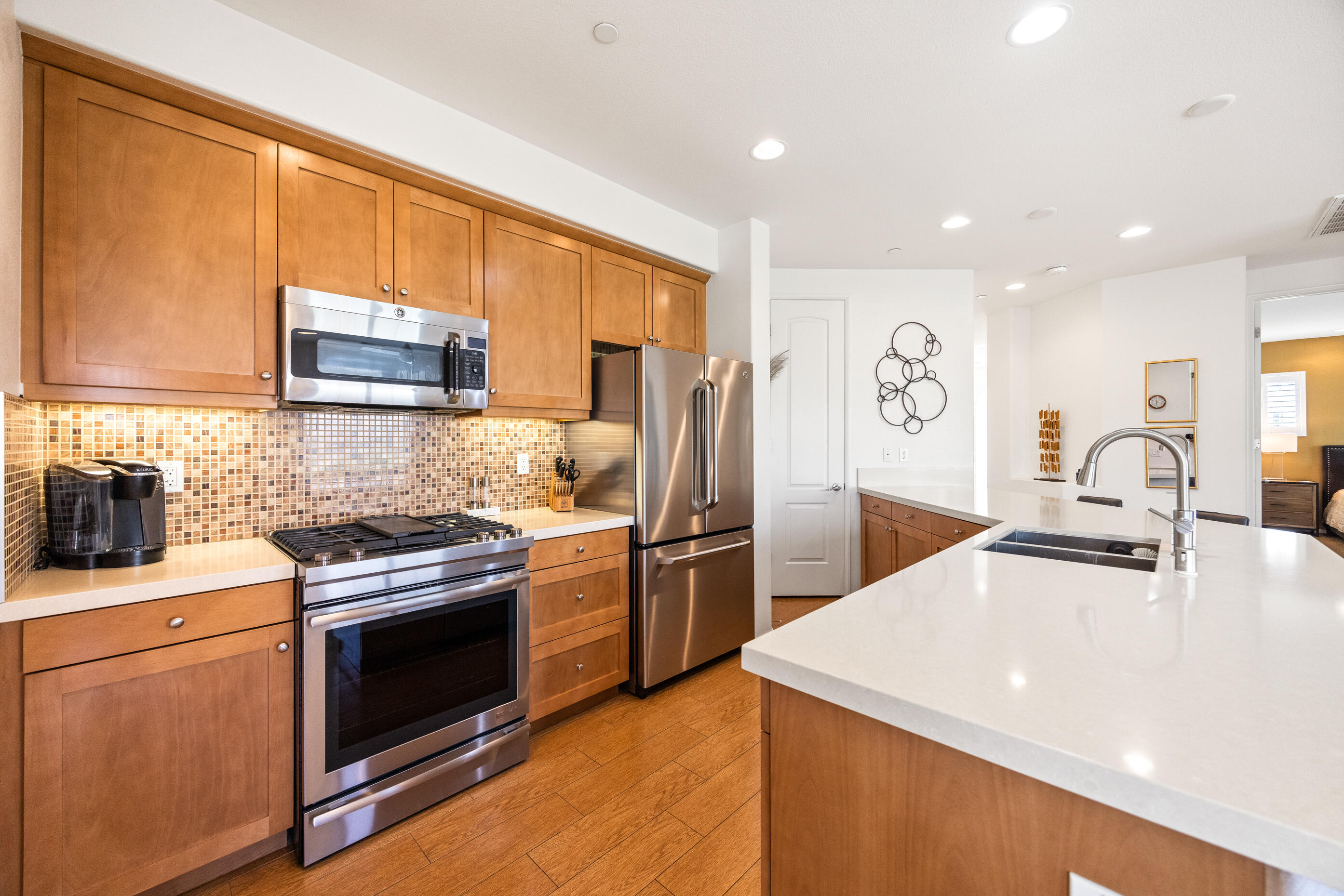 374 Terra Vita Palm Springs, CA 92262 - Photo 11 of 34 a kitchen with a stove a sink and a refrigerator