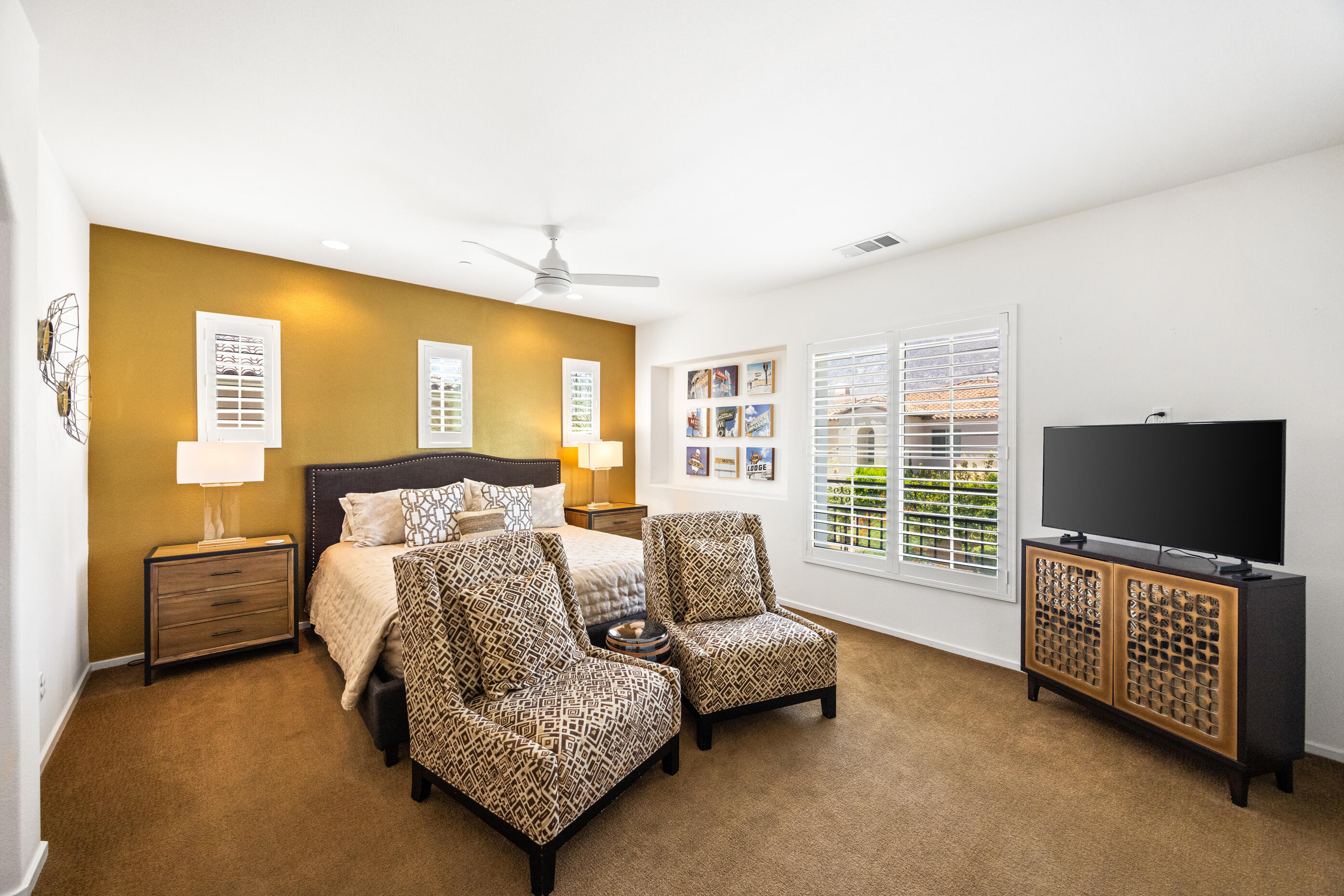 374 Terra Vita Palm Springs, CA 92262 - Photo 14 of 34 a bedroom with furniture and a flat screen tv
