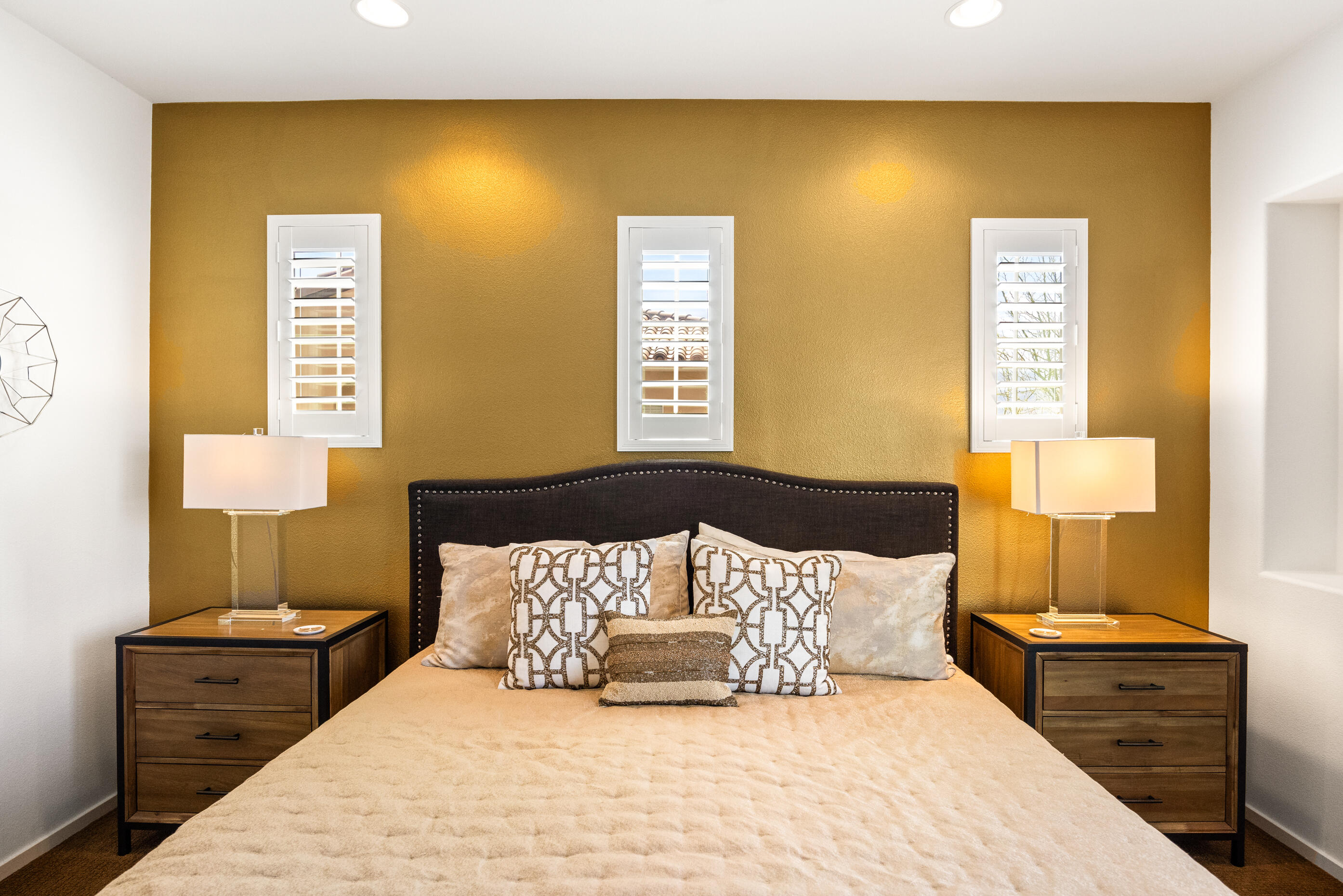 374 Terra Vita Palm Springs, CA 92262 - Photo 15 of 34 a bedroom with a bed and wooden floor