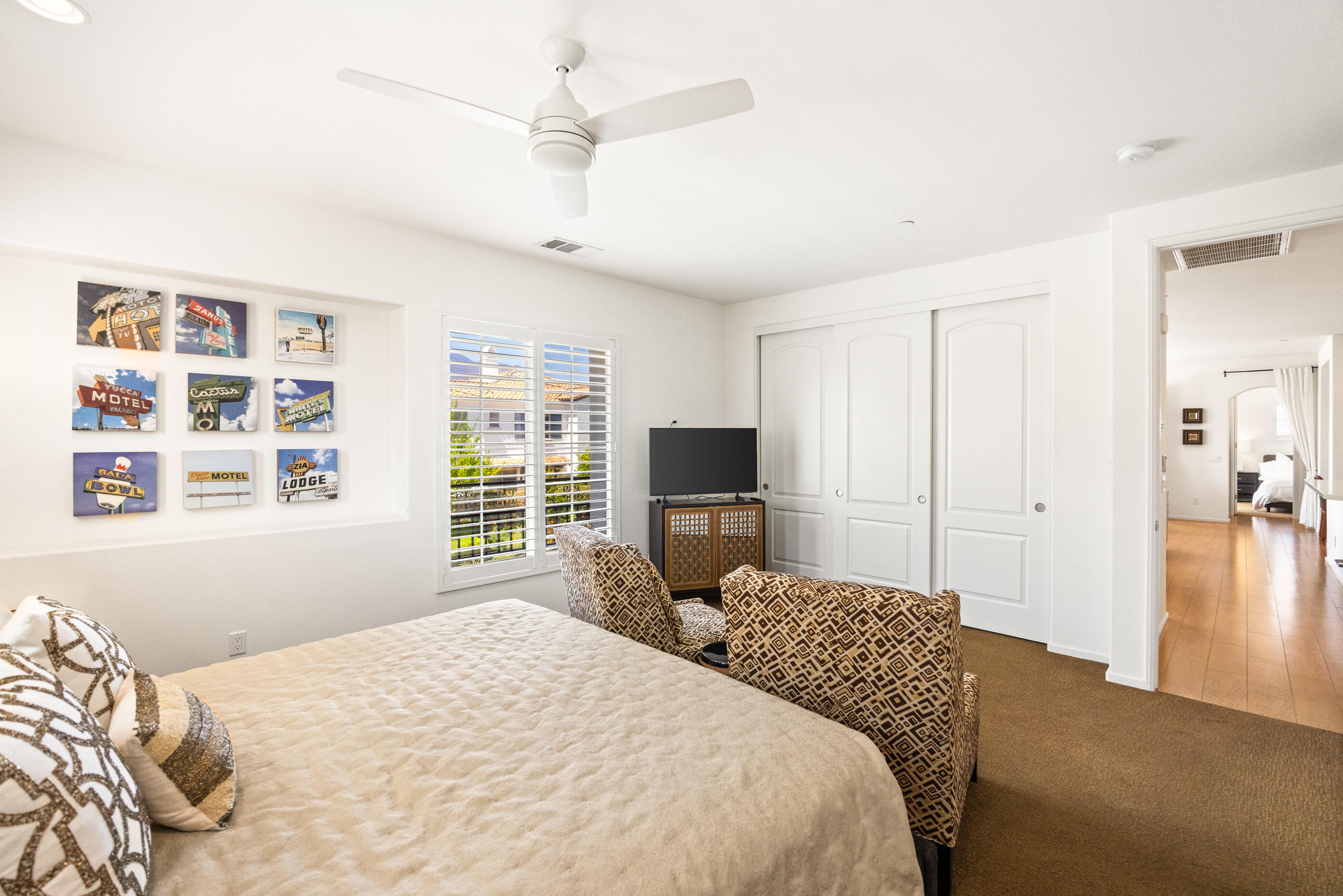 374 Terra Vita Palm Springs, CA 92262 - Photo 16 of 34 a bedroom with a bed and a flat screen tv