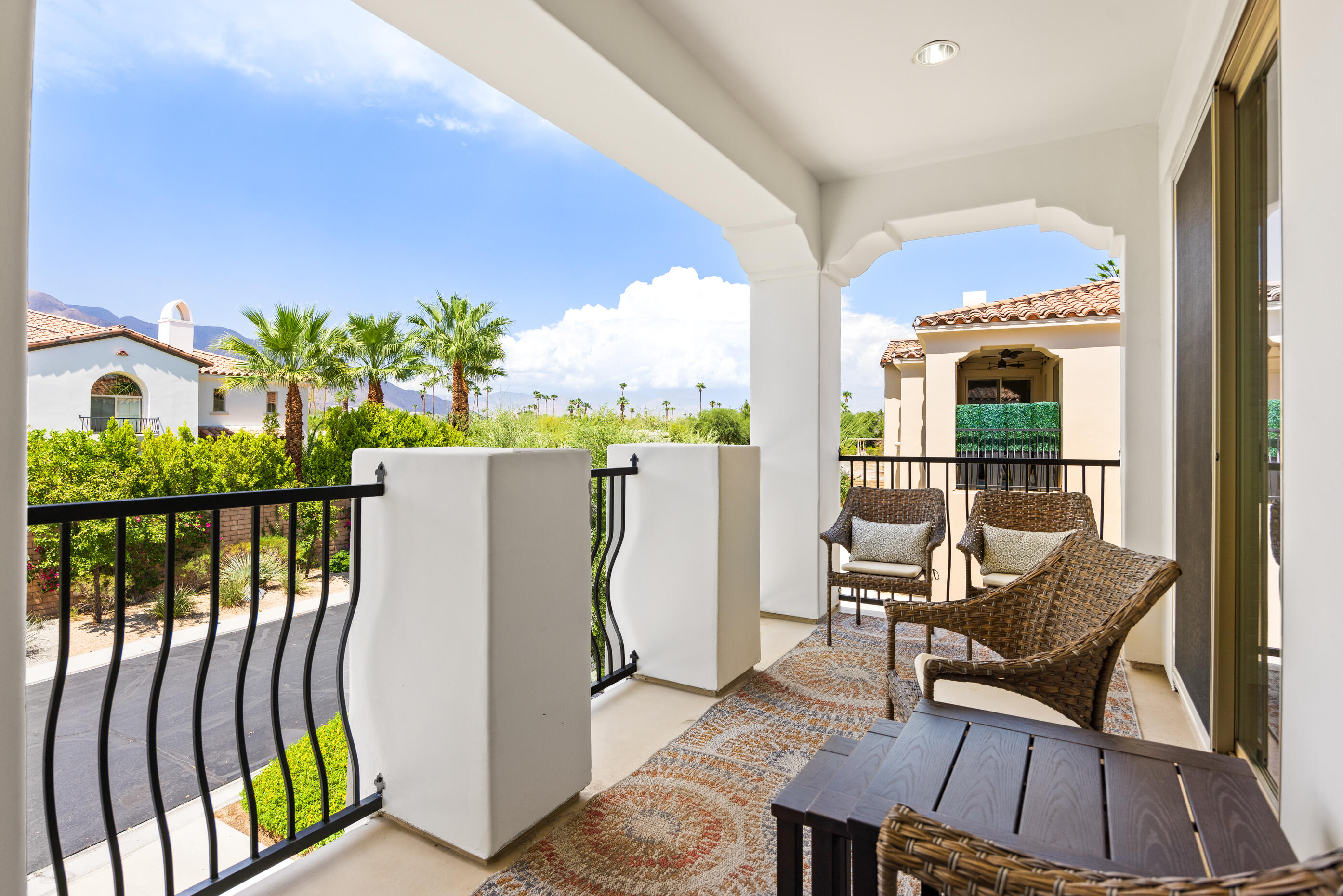 374 Terra Vita Palm Springs, CA 92262 - Photo 24 of 34 a view of a balcony with chairs and a potted plant