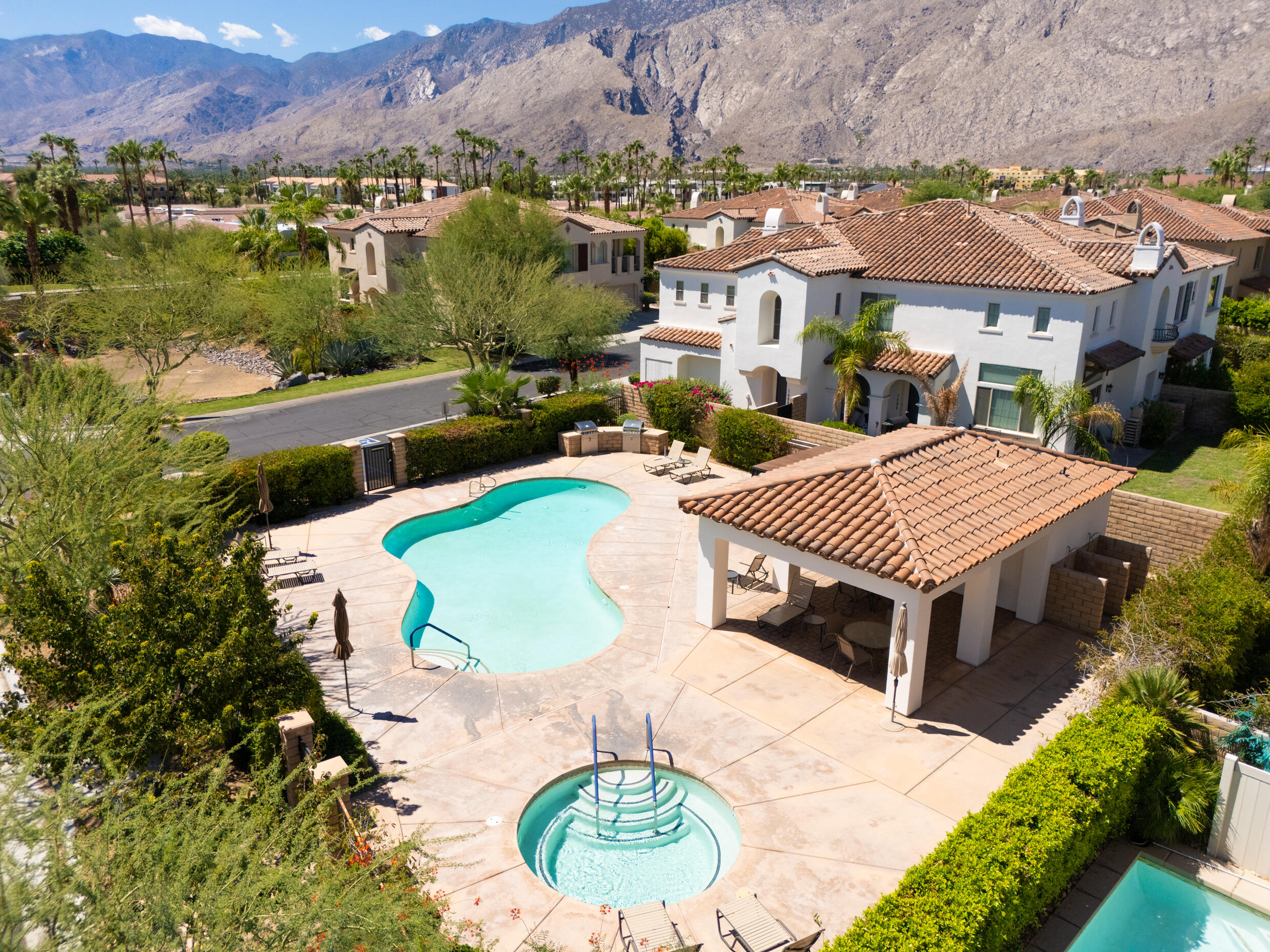 374 Terra Vita Palm Springs, CA 92262 - Photo 29 of 34 an aerial view of a house with a swimming pool and lake view