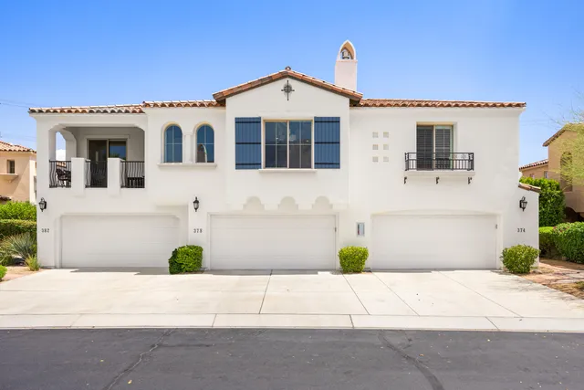 a front view of a house with a garage