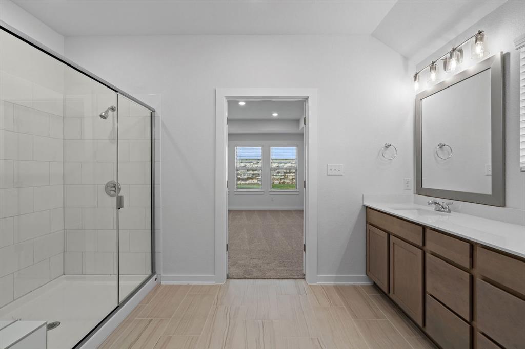 212 Brandywine Road Hutto, TX 78634 - Photo 12 of 35 Full bathroom featuring a stall shower and vanity