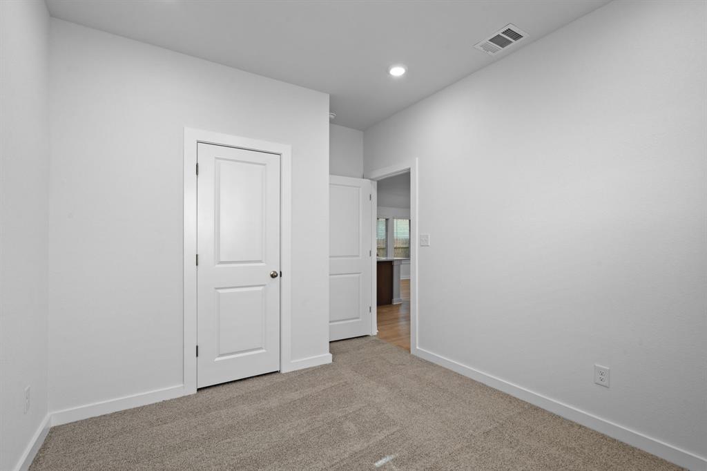 212 Brandywine Road Hutto, TX 78634 - Photo 17 of 35 Bedroom 3 featuring light carpet and recessed lighting