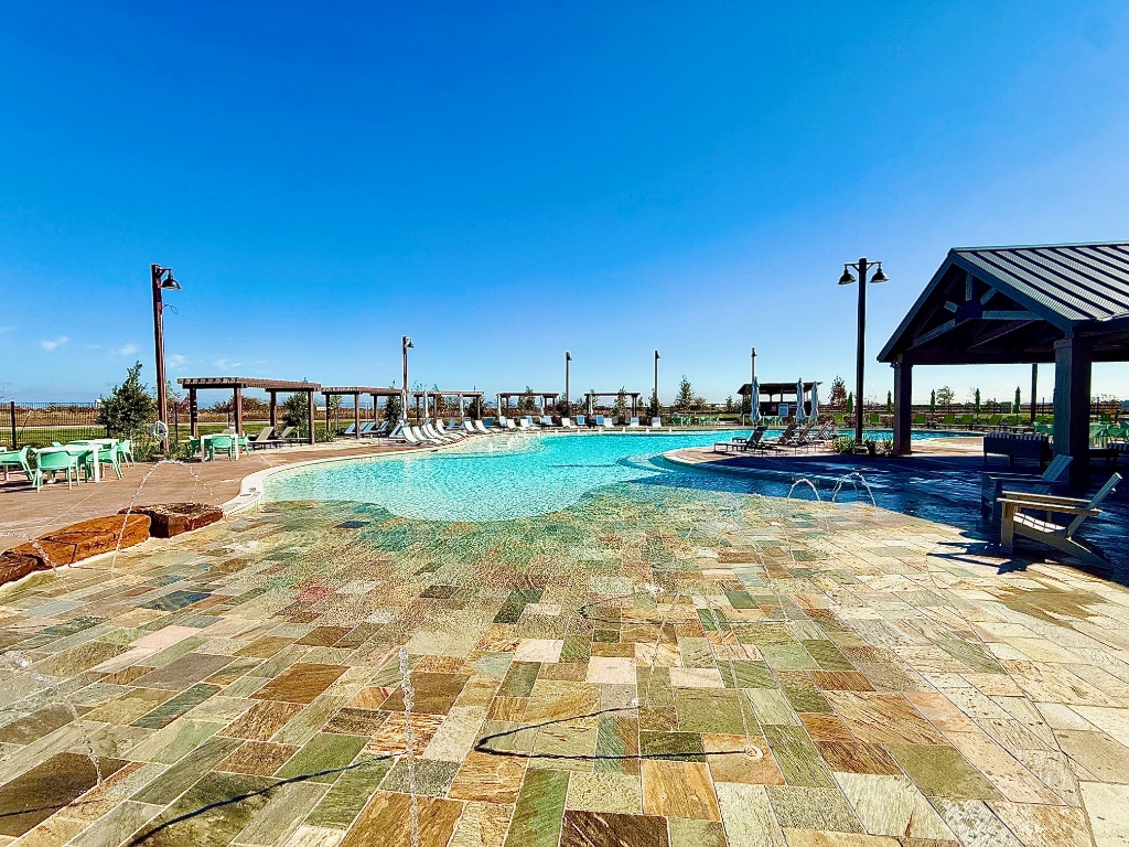 212 Brandywine Road Hutto, TX 78634 - Photo 24 of 35 Community pool with a patio area