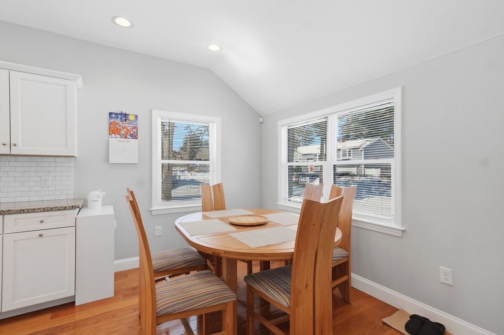 24 Holly Street Billerica, MA 01821 - Photo 11 of 33 a view of a dining room with furniture and wooden floor