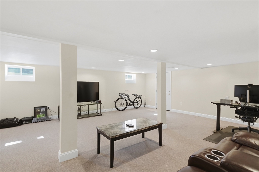 24 Holly Street Billerica, MA 01821 - Photo 23 of 33 a view of a livingroom with furniture and a flat screen tv