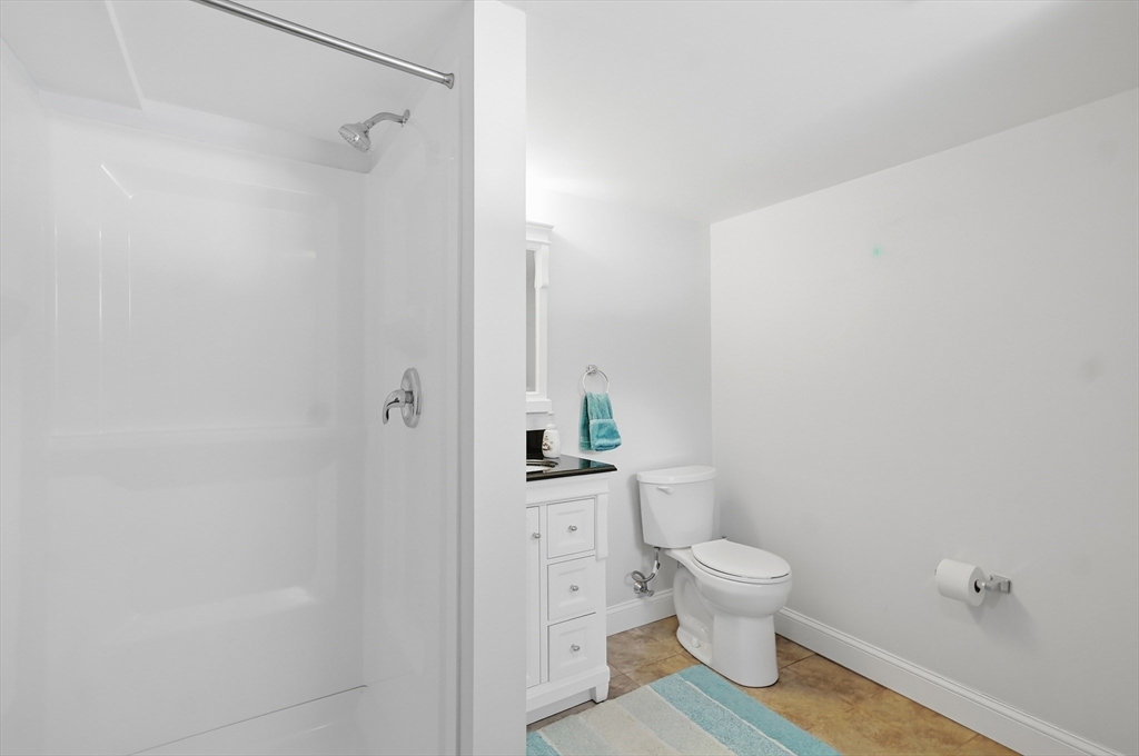 24 Holly Street Billerica, MA 01821 - Photo 24 of 33 a bathroom with a toilet and a shower